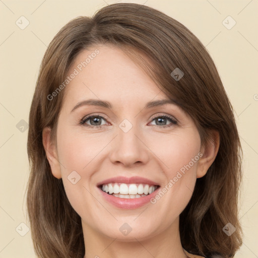 Joyful white young-adult female with long  brown hair and green eyes