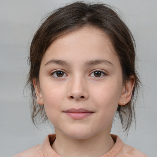 Joyful white child female with medium  brown hair and brown eyes