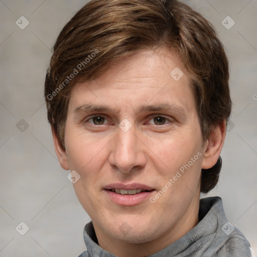 Joyful white adult male with short  brown hair and grey eyes