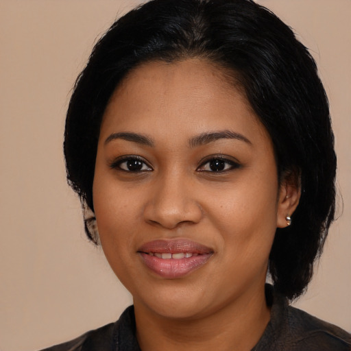 Joyful latino young-adult female with medium  black hair and brown eyes