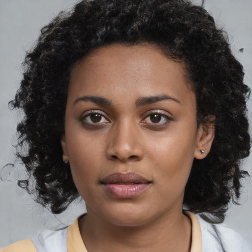 Neutral black young-adult female with medium  black hair and brown eyes