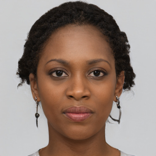 Neutral black young-adult female with short  brown hair and brown eyes
