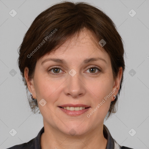 Joyful white adult female with medium  brown hair and grey eyes