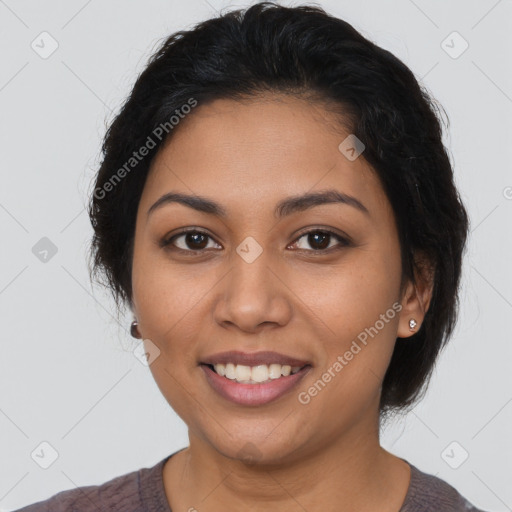 Joyful latino young-adult female with short  brown hair and brown eyes