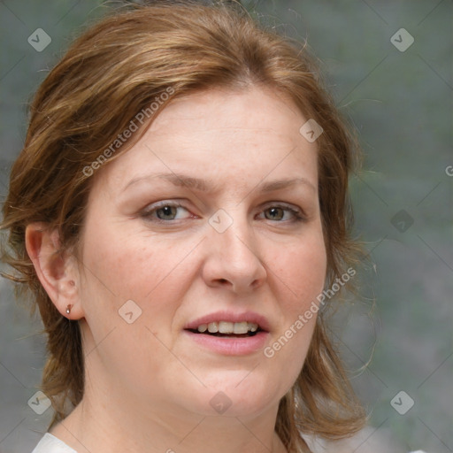 Joyful white adult female with medium  brown hair and blue eyes