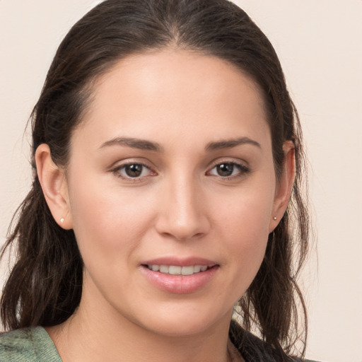 Joyful white young-adult female with medium  brown hair and brown eyes