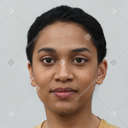 Joyful latino young-adult female with short  black hair and brown eyes