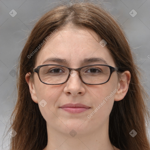 Joyful white adult female with long  brown hair and brown eyes