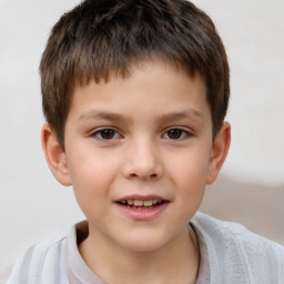 Joyful white child male with short  brown hair and brown eyes