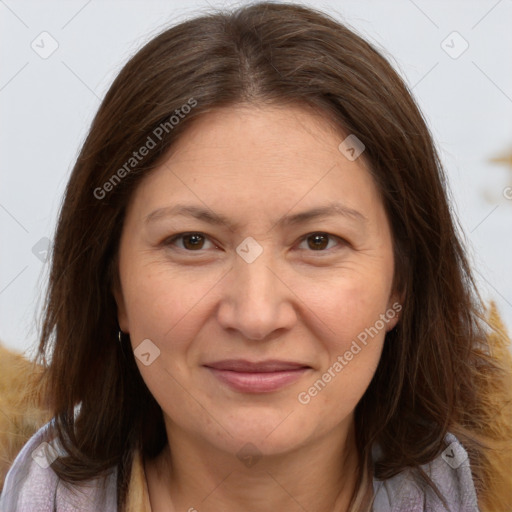 Joyful white adult female with long  brown hair and brown eyes