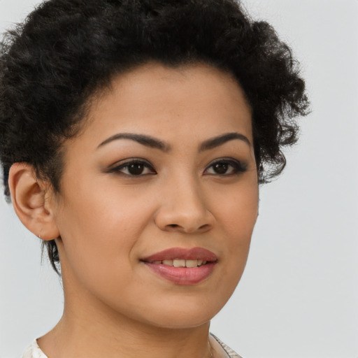 Joyful latino young-adult female with short  brown hair and brown eyes