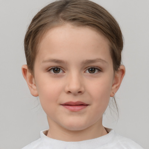 Joyful white child female with short  brown hair and brown eyes