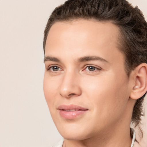 Joyful white young-adult male with medium  brown hair and brown eyes