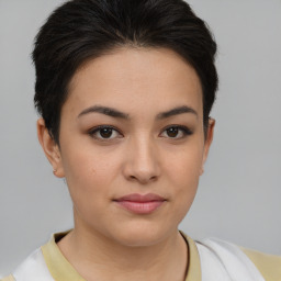 Joyful latino young-adult female with short  brown hair and brown eyes