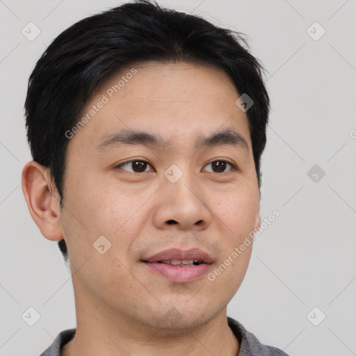 Joyful asian young-adult male with short  black hair and brown eyes