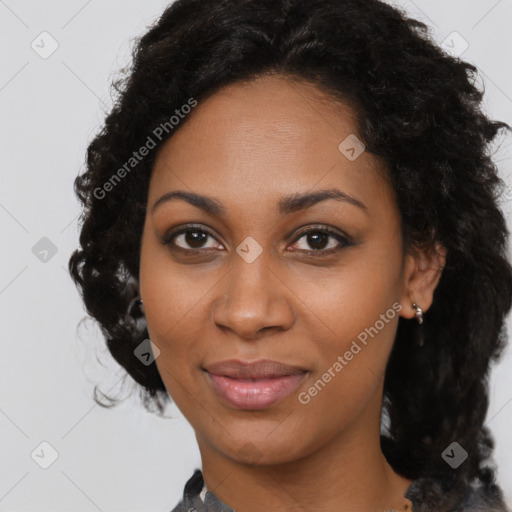 Joyful black young-adult female with medium  brown hair and brown eyes