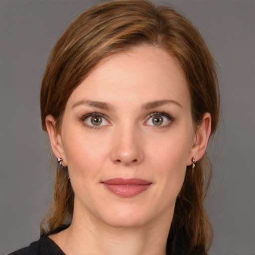 Joyful white young-adult female with medium  brown hair and brown eyes