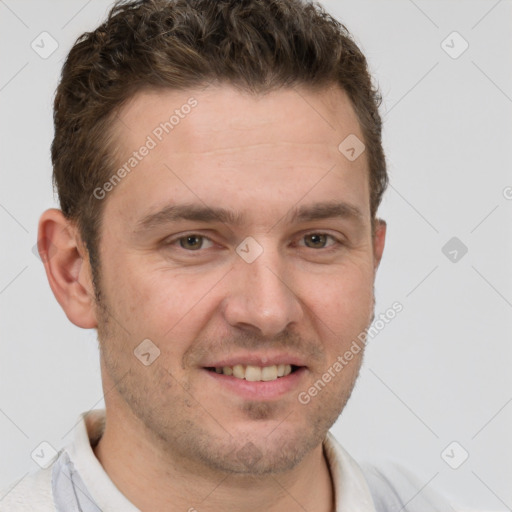 Joyful white adult male with short  brown hair and grey eyes