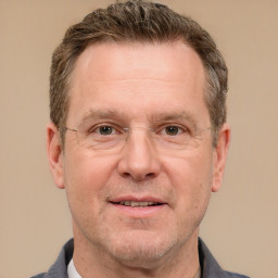 Joyful white adult male with short  brown hair and grey eyes