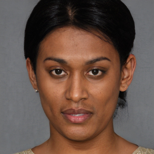 Joyful asian young-adult female with short  brown hair and brown eyes