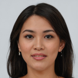 Joyful asian young-adult female with long  brown hair and brown eyes