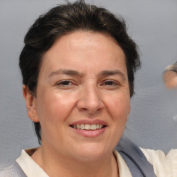 Joyful white adult female with short  brown hair and brown eyes