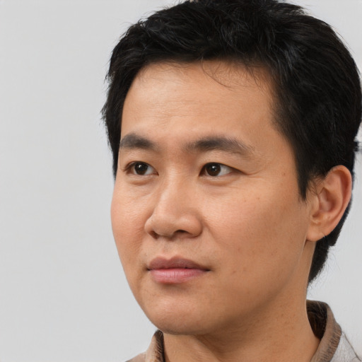 Neutral asian young-adult male with short  black hair and brown eyes