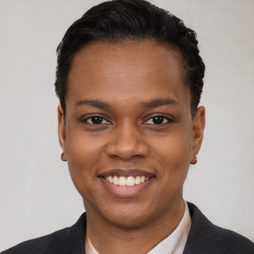 Joyful black young-adult female with short  black hair and brown eyes