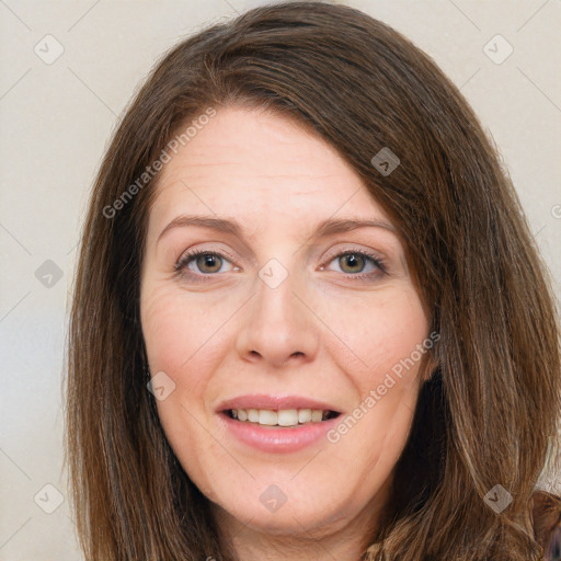 Joyful white adult female with long  brown hair and grey eyes