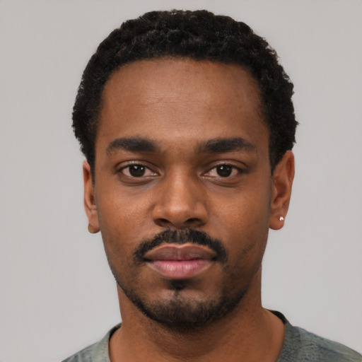 Neutral black young-adult male with short  black hair and brown eyes