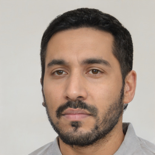 Neutral latino young-adult male with short  black hair and brown eyes