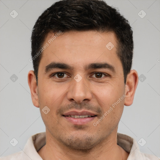 Joyful white young-adult male with short  black hair and brown eyes