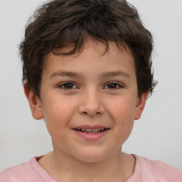 Joyful white child male with short  brown hair and brown eyes