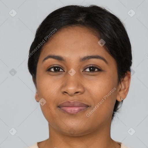 Joyful black adult female with short  brown hair and brown eyes