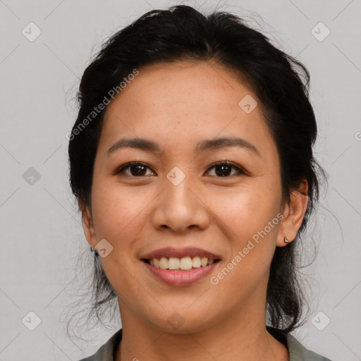 Joyful latino young-adult female with medium  black hair and brown eyes