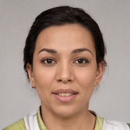 Joyful white young-adult female with medium  brown hair and brown eyes