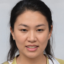 Joyful white young-adult female with medium  brown hair and brown eyes