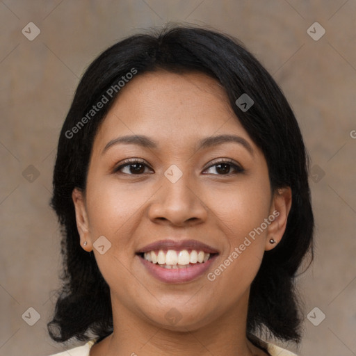 Joyful latino young-adult female with medium  black hair and brown eyes