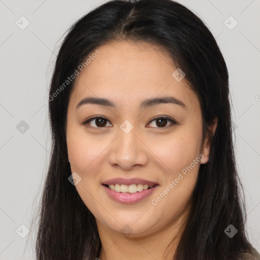 Joyful asian young-adult female with long  brown hair and brown eyes