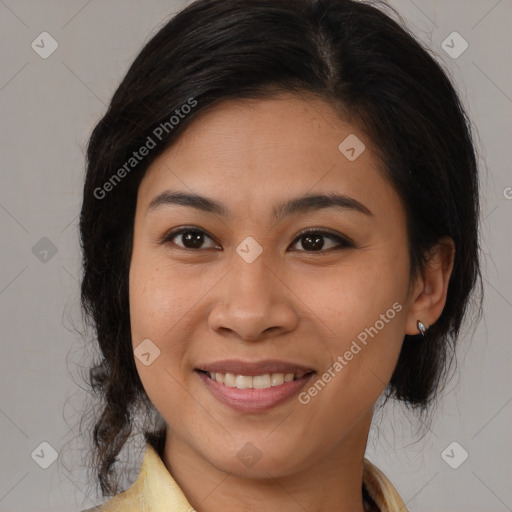 Joyful latino young-adult female with medium  brown hair and brown eyes