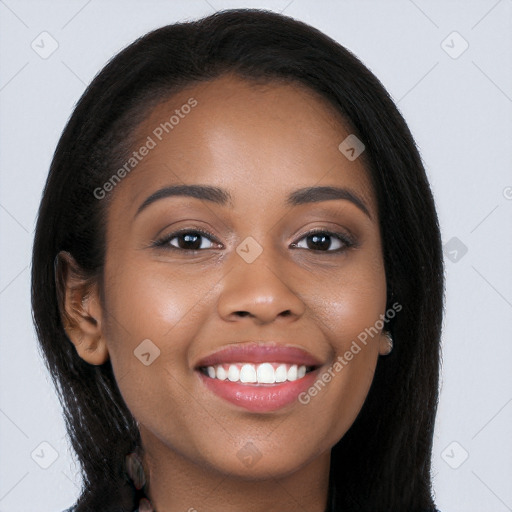 Joyful black young-adult female with long  brown hair and brown eyes