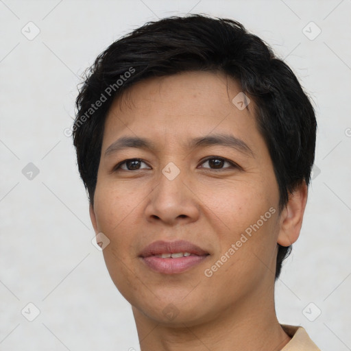 Joyful asian young-adult male with short  black hair and brown eyes