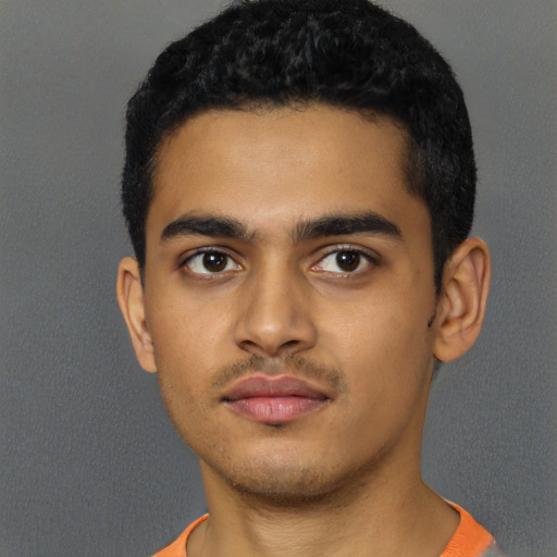 Neutral latino young-adult male with short  black hair and brown eyes