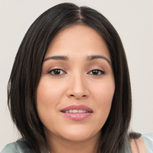 Joyful white young-adult female with medium  black hair and brown eyes