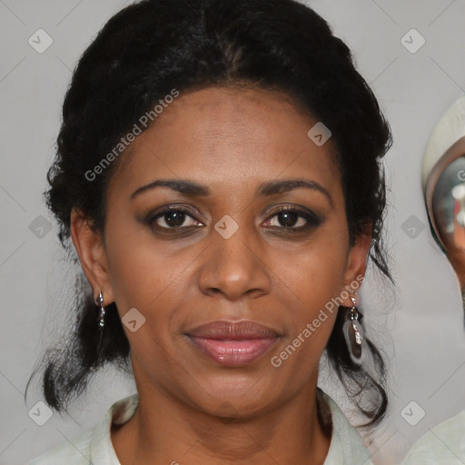 Joyful black adult female with medium  brown hair and brown eyes