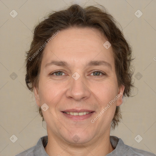 Joyful white adult female with short  brown hair and brown eyes