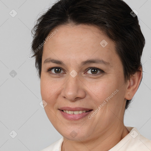 Joyful white adult female with medium  brown hair and brown eyes