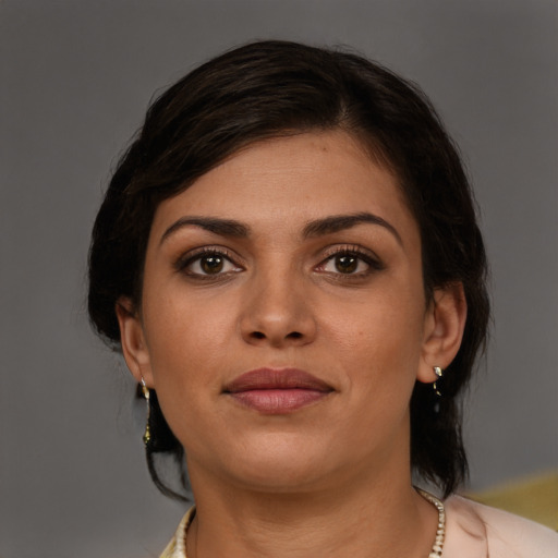 Joyful white young-adult female with medium  brown hair and brown eyes