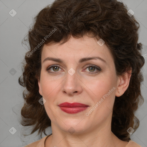 Joyful white young-adult female with medium  brown hair and green eyes