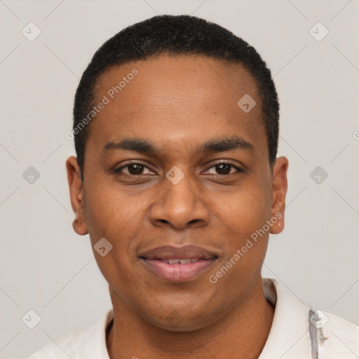 Joyful black young-adult male with short  black hair and brown eyes